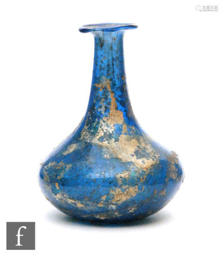 Roman 2nd to 4th Century AD - A miniature blue glass flask, the slender neck to an ovoid base, height 6cm