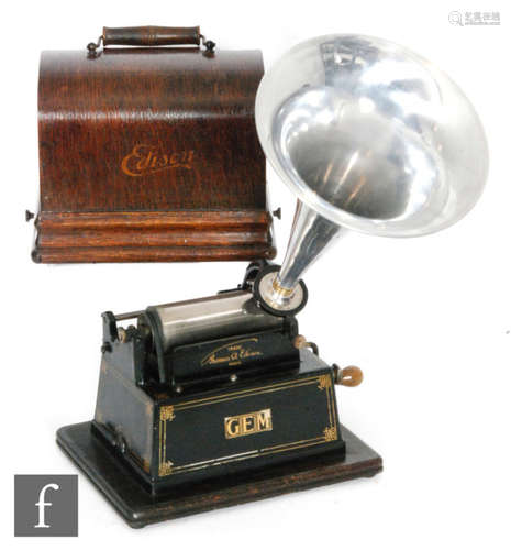 An Edison Gem phonograph serial No 303011C, model C reproducer with later aluminium horn, oak case on plinth base, width 25cm