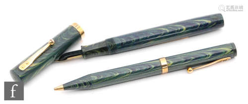 A Watermans fountain pen, 14ct gold 4 nib and 9ct gold band, green and blue marble effect case with a matching propelling pencil. (2)