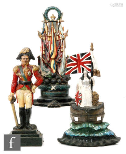 A 19th Century cast iron door stop depicting the Duke of Wellington, another of ceremonial flags and cannons and a repainted Britannia door stop, height 46cm. (3)