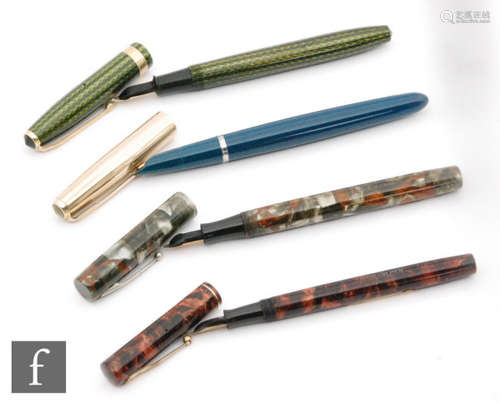 A Watermans Ideal fountain pen grey and brown marbled effect pen, another in umber, a Conway Stewart green zig-zig effect case and a later Parker blue pen. (4)