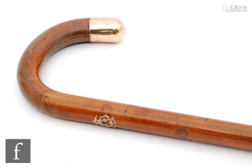 A gold topped gentleman's walking stick with pierced initial monogram mount, length 91cm.