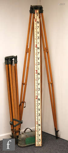 A Troughton & Simms grey painted surveyors level S038397, cased, also two Hilger and Watts tripods and an adjustable ruler. (4)