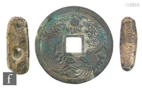 China - A lucky fortune bronze coin, one side with symbols the other with dragons chasing a flaming pearl, width 104mm and two Indonesian white metal ingots each stamped with flower character marks (3)