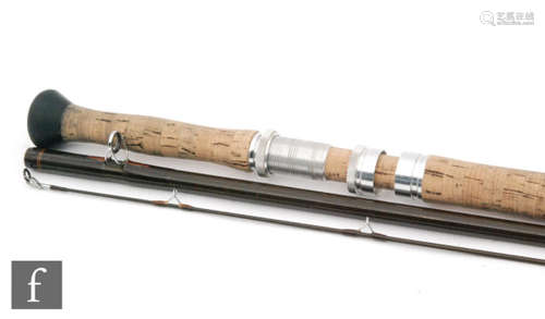 A Sage Graphite III 10150-3 double handed fly rod, 3 piece, 15' in Sage metal rod tube.