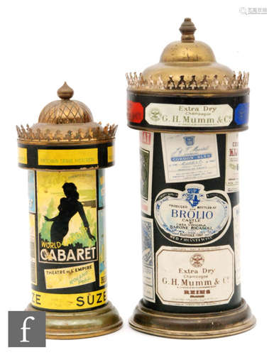 A 1950s musical decanter of cylindrical form and a similar cigarette dispenser, each with period advertising labels, Cordon Rouge, champagne, height 29cm (2)