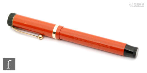 A Parker Duofold fountain pen, orange case.