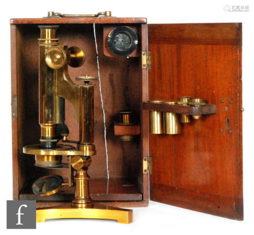 A late 20th Century brass microscope by R & J Beck London and Philadelphia No. 10737 on tricorn base with accessories in fitted mahogany case, height 26.5cm