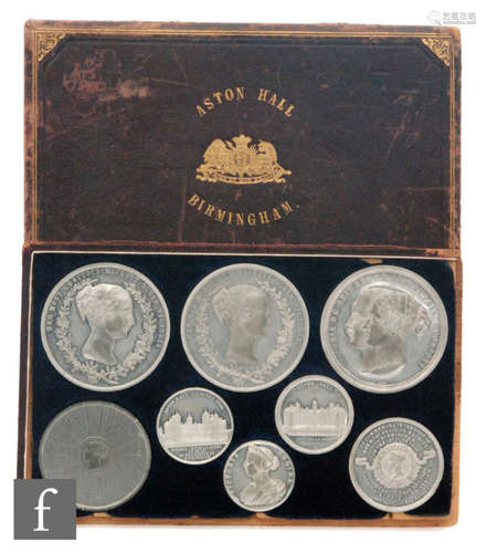 A cased set of eight Victoria silvered commemorative medallions for the visit of Queen Victoria to Birmingham to open Aston Hall and park 15th June 1858, cased.