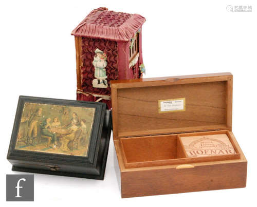 A small 19th Century ebonised table musical box playing two airs, the cover printed with a scene of playing cards and a Swiss musical box with Thorens movement and a similar box (3)