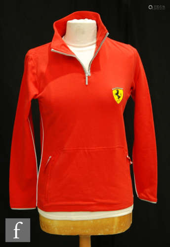 A collection of ladies Ferrari licensed products to include a track side jacket, t-shirts, scarves and caps. (qty)