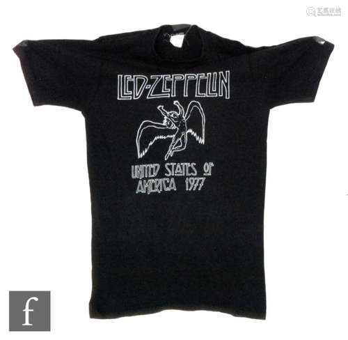 A Led Zeppelin original 'United States of America' 1977 tour t-shirt, the black t-shirt with white text. NB: Provenance, given to the the current vendor by a member of the band tour crew,