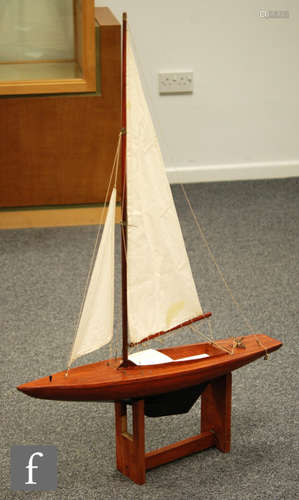 A 1950s and 1960s single masted wooden pond yacht on stand, height 114cm