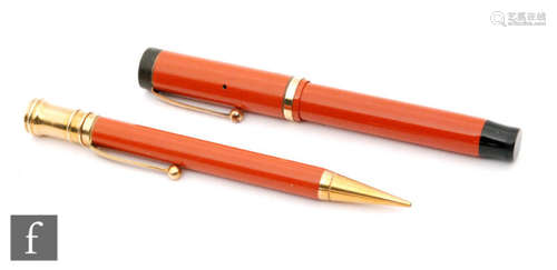 A Parker Duofold fountain pen, orange case and matching propelling pencil (2)