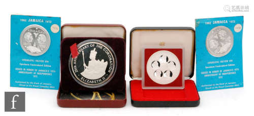 Jamaica - A 1978 twenty five dollar silver proof coin, two 1962 ten dollar silver proof coins, a 1978 Cayman Islands silver proof fifty dollar coin with two certificates (4)