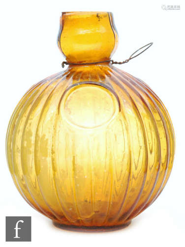 A French amber Unic glass fire grenade of ribbed form, height 14cm