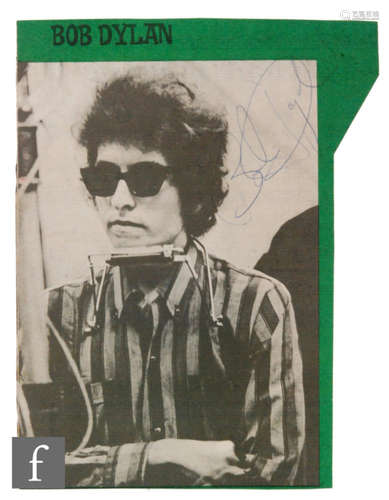 A signed Bob Dylan cutting, in blue ink, signed to the top right corner of a black and white magazine cutting, 23cm x 16cm. Provenance: Acquired Albany hotel, 1966