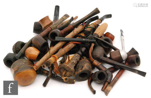 A collection of 19th Century and later pipes, mainly wooden, to include pipes of plain form, carved figural examples, novelty items, etc. (qty.)