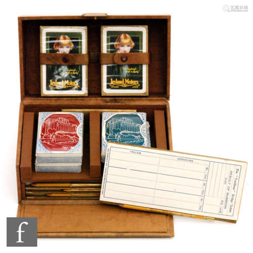 A 1930s leather cased bridge set fitted with two packs of Leyland Motors pictorial cards and four unopened packs of Shell and BP cards, also score cards and pencils.