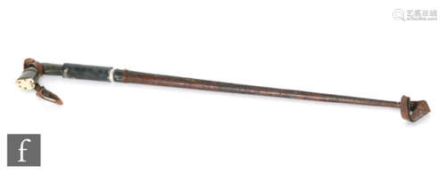 A late 19th Century sword stick in the form of a riding crop, the handle in the form of a horses hoof with horn end with leather scabbard, length 70cm