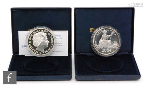 Elizabeth II - A 2004 silver proof 5oz commemorative coin for New York to Southampton and a ten pound Guernsey issue for a Century of the Monarchy with certificates, cased (2)