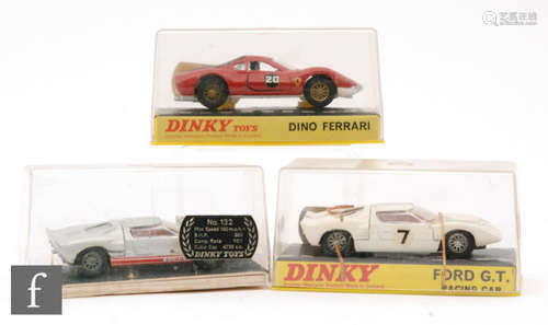 Three boxed Dinky Toys diecast model cars, #132 Ford 40RV in silver with red interior, #216 Dino Ferrari and #215 Ford GT in white with spoked wheels, S/D to boxes. (3)