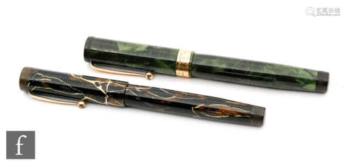 A Swan fountain pen with 14ct gold 4 nib, engraved collar dated 17-10-41, green marbled effect case and a Swan leverless pen with 14ct gold 2 nib in brown marbled effect case. (2)