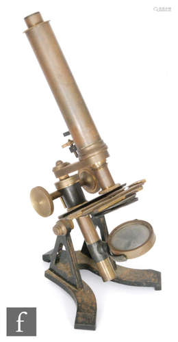 An early 20th Century brass compound microscope on a cast black painted base, height 37cm.