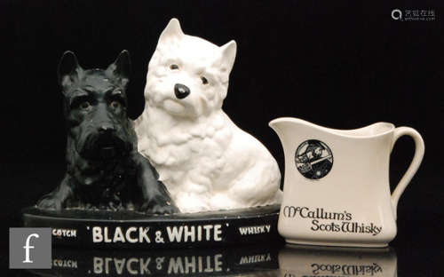 A Brentleigh Scottie dog advertising figure group for Scotch whisky and a Royal Doulton Scotch whisky jug. (2)