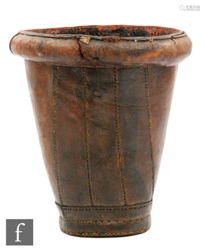 A 19th Century stitched brown leather fire bucket, stamped with a makers mark above a G, height 34cm