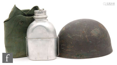 A World War Two paratroopers helmet, with label for Aldershot regiment and an aluminium water bottle in canvas case (2)