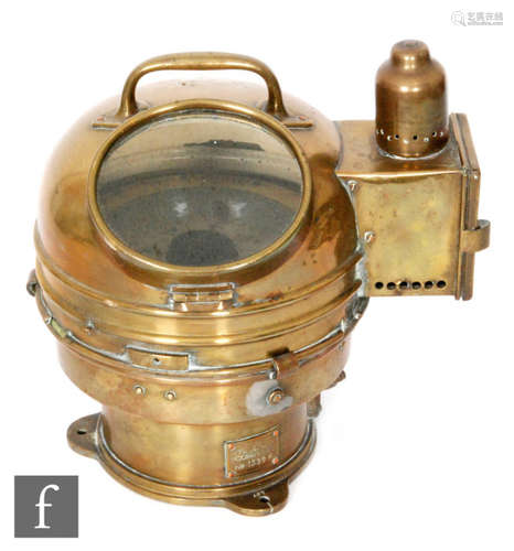 An early 20th Century brass ship's compass patent number 01151A 1339K, terminating in arched top carrying handle, height 26cm.