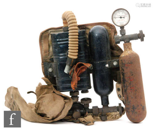 A World War Two scuba diving apparatus to include oxygen tank and canvas fittings and a separate tank with Siebe Gorman & Co London dial (2)