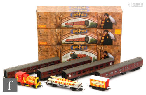 An OO gauge Hornby Harry Potter set, comprising 4-6-0 Hogwarts Railway red 'Hogwarts Castle' locomotive and four coaches, all with boxes, together with an unboxed Hornby Bartellos' Big Top Circus set, comprising locomotive and two wagons. (8)