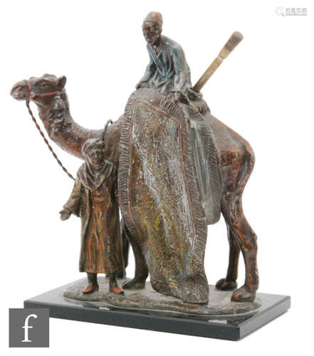 An early 20th Century Bergmann style spelter table lighter in the form of a carpet seller on an ebonite rectangular base, height 19cm.