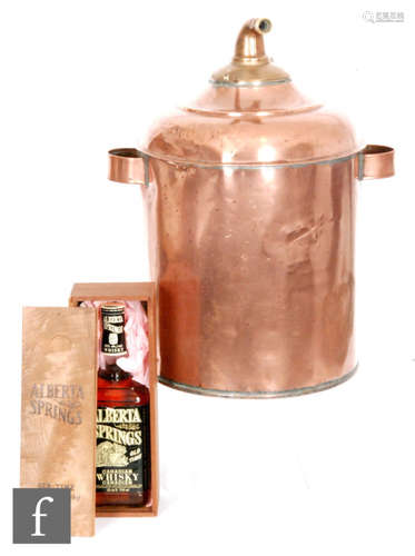 A copper cylindrical whisky still, height 48cm and a 710ml bottle of Alberta Springs Canadian whisky. (2)