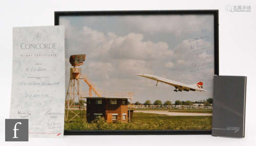 A collection of Concorde memorabilia to include a signed photograph by Bill Brown flight engineer and others, 30cm x 40cm, also a menu, notebook, tickets, first day covers, etc. (qty)