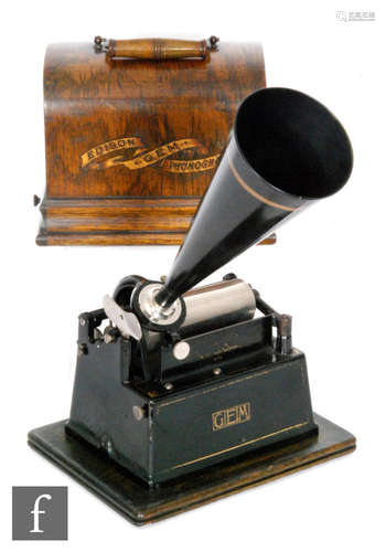 An Edison Gem phonograph serial No G116835, model B reproducer and key wind operation with later aluminium horn and oak case on plinth base, width 25cm and spare horn (2)