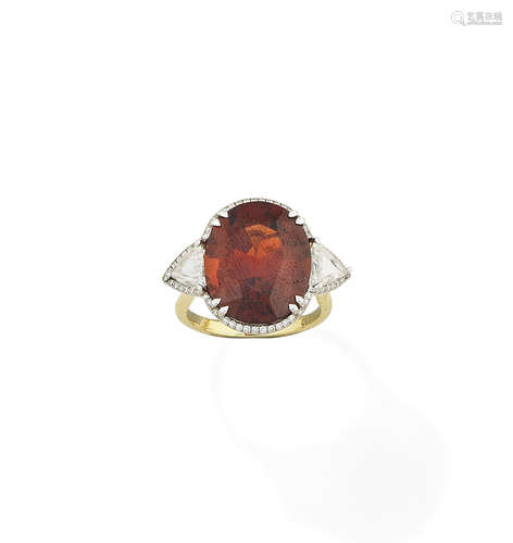 A spessartite garnet and diamond ring