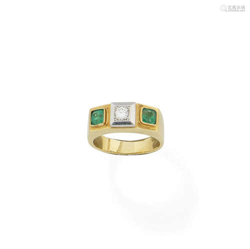 An emerald and diamond three-stone ring