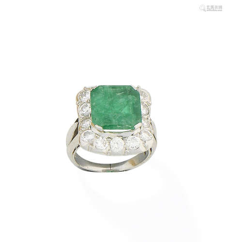 An emerald and diamond ring