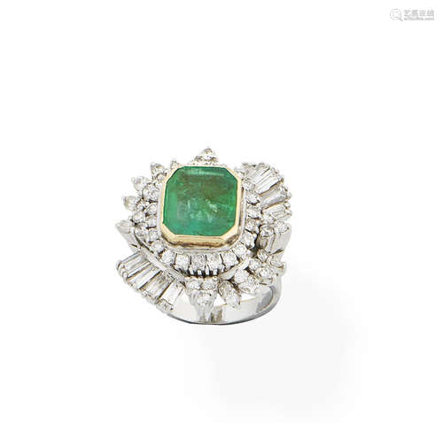 An emerald and diamond dress ring