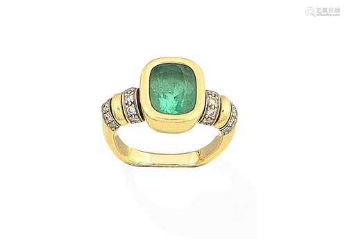 An emerald and diamond ring