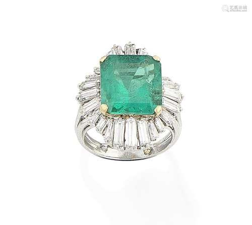 An emerald and diamond cluster ring