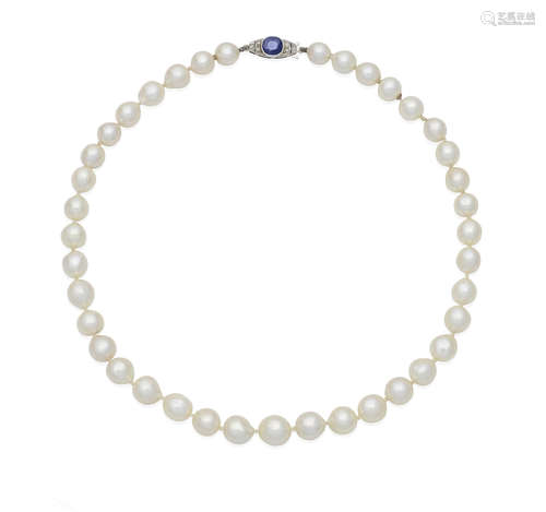 A cultured pearl necklace with a sapphire and diamond clasp