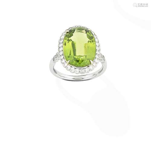 A peridot and diamond ring