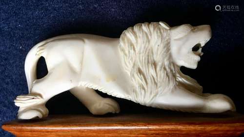 Bone carved Lion decoration, 4 x 1.75Â