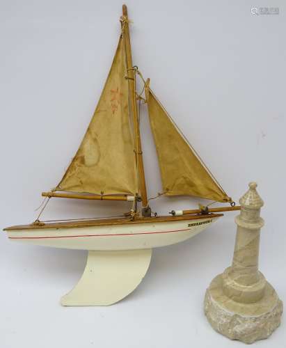 Carved Serpentine stone model of a lighthouse and Star Birkenhead pond yacht (2)