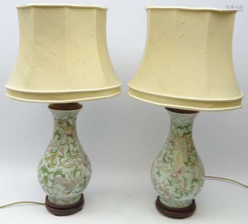 Pair Chinese baluster vases decorated with butterflies amongst foliage on pastel ground,