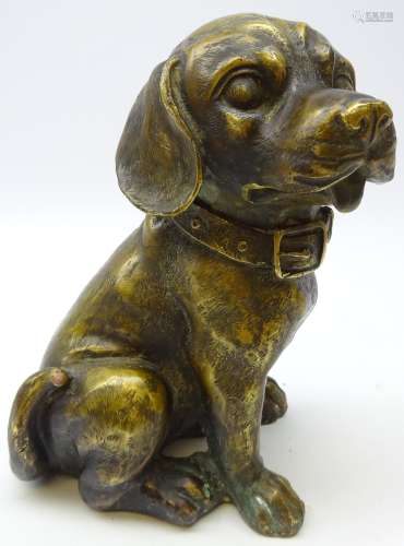 Patinated cast bronze model of a seated dog,